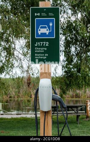 Parks Canada Tesla charging station at Point Pelee National Park, Leamington, Ontario, Canada Stock Photo