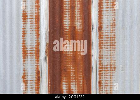 Galvanized wall panel with rust marks on the galvanized sheet background. Stock Photo