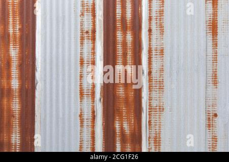 Galvanized wall panel with rust marks on the galvanized sheet background. Stock Photo