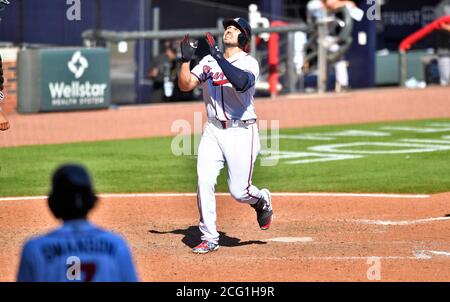 Miami Marlins left fielder Adam Duvall (14) and shortstop Miguel