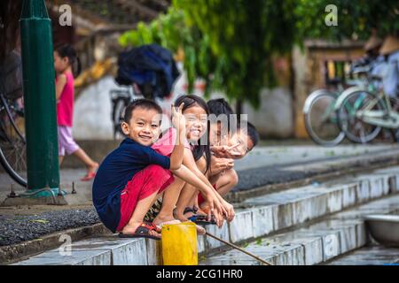 TAM COK, THAILAND - November 11, 2018: CHILDREN FISHING IN RIVER. Stock Photo