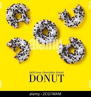 creative composition of donuts on a yellow background. Flat lay delicious nibbled chocolate donuts and simple text. Stock Photo