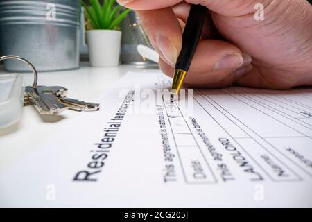 Completing a generic rental agreement Stock Photo