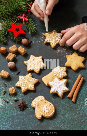 Christmas pastries. Homemade Gingerbread cookies on a background of stone or slate. Stock Photo