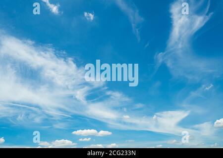 White fluffy clouds on blue sky. Soft touch feeling like cotton. White cloudscape with space for text. Beauty in nature. Close-up white cumulus clouds Stock Photo