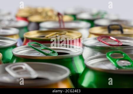 Many empty cans. A lot of opened soda, soft drink, lemonade, cola, beer or energy drink containers. Recycling, a lot of recycled cans. Stock Photo