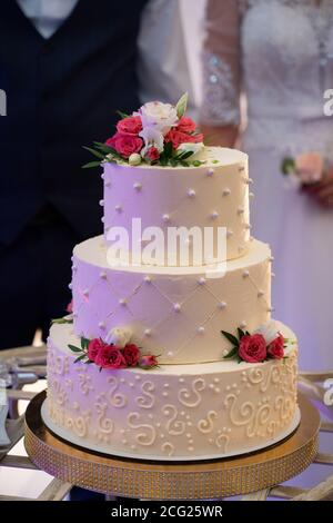Wedding cake, hands and the knife, cutting Stock Photo