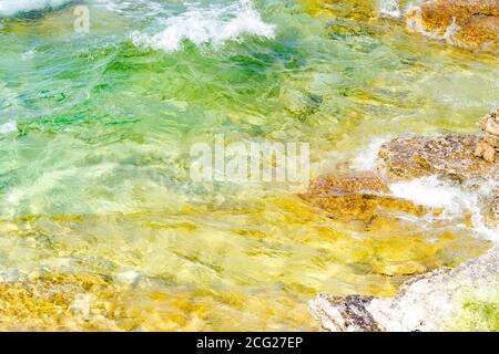Waves hitting the shore as seen from above. Impressionism. Stock Photo