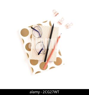 Composition with notepads, stationery and glasses on white background Stock Photo
