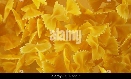 Freeze motion of flying uncooked pasta, food preparation concept Stock Photo