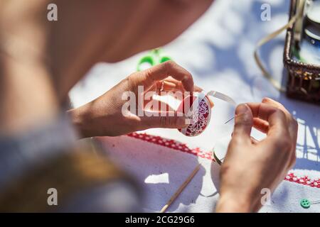 Workshop of decorating easter eggs  in beautiful hungarian village Holloko, Hungary Stock Photo