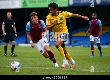 SOUTHEND, ENGLAND - SEPTEMBER 06: Harry Kyprianou of Southend United holds of Harrison Ashby of West Ham United U21during EFL Trophy Southern Group Ab Stock Photo