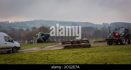 Art handlers removing a Henry Moore sculpture at Yorkshire Sculpture Park near Wakefield, Yorkshire, UK Stock Photo