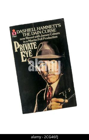 An old battered paperback copy of The Dain Curse by Dashiell Hammett. First published in 1929 and filmed as a TV series Private Eye in 1978. Stock Photo