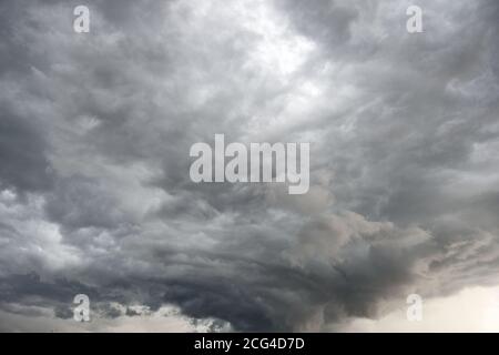Funnel clouds circulating, rotating, and swirling in the atmosphere above northern Wyoming, USA Stock Photo