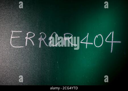 Error 404 written on green board with chalk, Page Not Found Error 404 written on a blackboard with chalk. Stock Photo