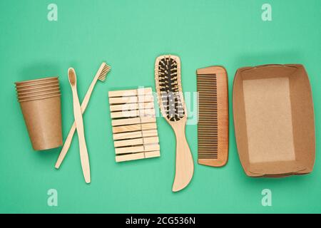 various household items from recyclable raw materials on a green background, top view, zero waste Stock Photo