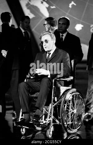 Actor Peter Sellers sits in a wheelchair portraying the titular character during production of the 1964 movie 'Dr. Strangelove or 'How I Learned to Stop Worrying and Love the Bomb', directed by Stanley Kubrick. *7/3/1999: Kubrick died today (Sunday) at his home near Harpenden, Hertfordshire. He was 70. *13/07/00: A unique collection of papers relating to Kubrick are due to be auctioned by Sotheby's. Stock Photo