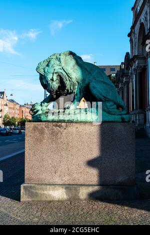 Statue of a lion in front of the Ny Carlsberg Glyptotek, art museum in Copenhagen, Denmark Stock Photo