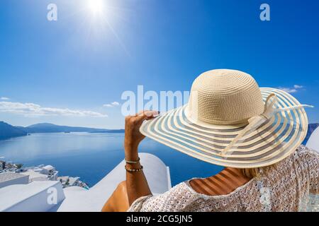 Woman on holidays in Santorini island in Greece Stock Photo