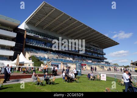 Racegoers next to the course and in the stands as a pilot scheme for the return of crowds to sporting events is expected to bring in 2500 spectators during day one of the William Hill St Leger Festival at Doncaster Racecourse. Stock Photo
