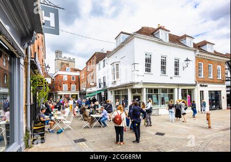 Outdoor socially distanced lunchtime dining and drinking in The Square in the pedestrianised historic city centre of Winchester, Hants, south England Stock Photo