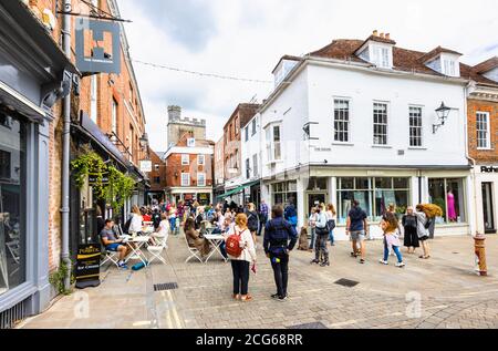 Outdoor socially distanced lunchtime dining and drinking in The Square in the pedestrianised historic city centre of Winchester, Hants, south England Stock Photo