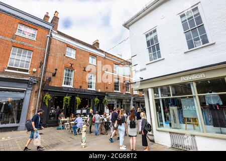 Outdoor socially distanced lunchtime dining and drinking in The Square in the pedestrianised historic city centre of Winchester, Hants, south England Stock Photo