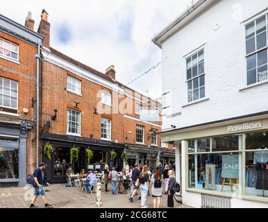Outdoor socially distanced lunchtime dining and drinking in The Square in the pedestrianised historic city centre of Winchester, Hants, south England Stock Photo