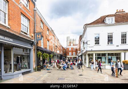 Outdoor socially distanced lunchtime dining and drinking in The Square in the pedestrianised historic city centre of Winchester, Hants, south England Stock Photo