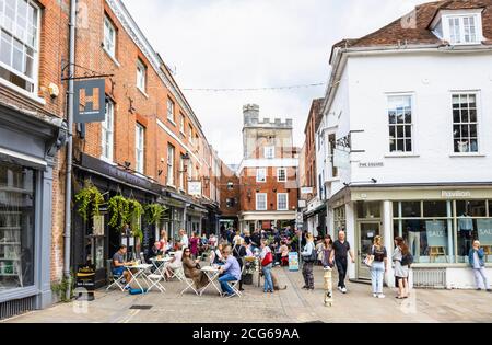 Outdoor socially distanced lunchtime dining and drinking in The Square in the pedestrianised historic city centre of Winchester, Hants, south England Stock Photo