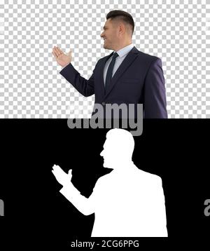 Business man pointing on product and talking to camera, Alpha Channel Stock Photo