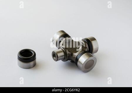 Cross joint for propeller shaft. New auto part for transmission. Trade Auto parts, car service. Automotive industry. Selective focus. Stock Photo