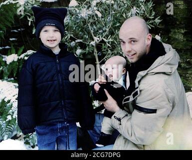 EDITORIAL USE ONLY: Undated collect photo of Kevin Jackson, with his children Jake (left) and baby Tom, who was murdered while he chased suspected car thieves from his home in Halifax. Mr Jackson was found severely beaten in Copley Lane, Halifax, West Yorkshire, on 30/12/01.  *... The 31-year-old father-of-two was taken to hospital but died on New Year's Day.  Stock Photo