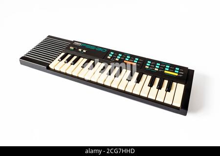 A vintage 1980s Yamaha PortaSound PSS-30 mini electronic music keyboard isolated on a white background Stock Photo