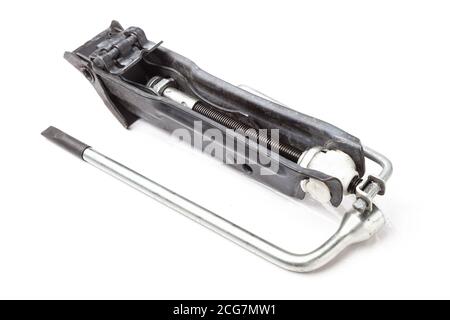 Travel set for repairing a car in case of a breakdown on the road - a wrench and a jack on a white isolated background in a photo studio, a spare tool Stock Photo