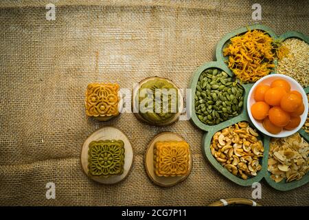 Flat lay mid autumn festival colorful food and drink on burlap background. Travel. holiday, food concept Stock Photo