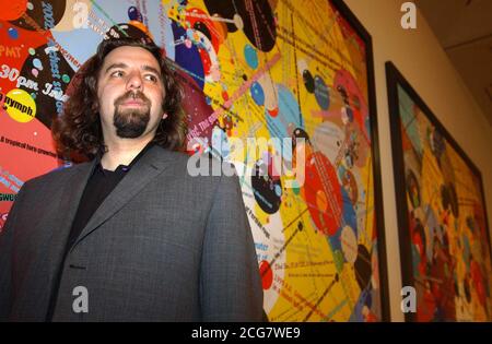 33-year-old Keith Tyson with his piece 'Bubble Chambers' after winning the 2002 Turner prize at the Tate Britain Gallery, London. Mr Tyson,   *..known for casting the entire contents of a Kentucky Fried Chicken menu in lead at the behest of a computer landed the prize for his science-inspired works - yet despite gaining renown for some of his wackier stunts, his victory was a rare Turner triumph for a painter. He had been favourite to take the  20,000 prize after displaying a vivid collection of thought-provoking works at the Turner exhibition at Tate Britain, where the award was made at a rec Stock Photo