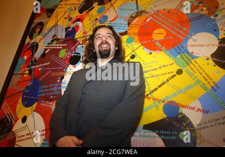33-year-old Keith Tyson with his piece 'Bubble Chambers' after winning the 2002 Turner prize at the Tate Britain Gallery, London. Mr Tyson, *..known for casting the entire contents of a Kentucky Fried Chicken menu in lead at the behest of a computer landed the prize for his science-inspired works - yet despite gaining renown for some of his wackier stunts, his victory was a rare Turner triumph for a painter. He had been favourite to take the 20,000 prize after displaying a vivid collection of thought-provoking works at the Turner exhibition at Tate Britain, where the award was made at a rec Stock Photo
