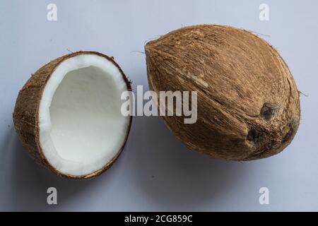 Coconut whole and in half isolated on white background. Stock Photo