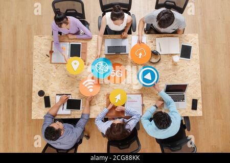 Office workers face to face with symbolic ICONS Stock Photo