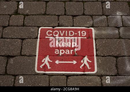 Bolton City Centre during new lockdown rules. Covid-19 sign reminding public to keep apart. Social distancing sign on the floor. 2020 Stock Photo