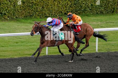 Limaro Prospect ridden by Luke Morris (left) win The Try Our New Price Boosts At Unibet Handicap at Kempton Park Racecourse. Stock Photo