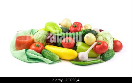 Composition of ripe fresh vegetables and a glass of vegetable juice on a white background with water drops. Stock Photo
