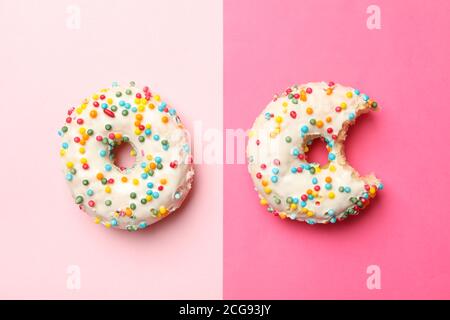 Two tasty donuts on two tone background Stock Photo
