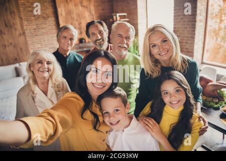 Closeup portrait photo of full big family gathering eight people make selfie cuddle embrace wait pray thank god have good autumn time make wish Stock Photo