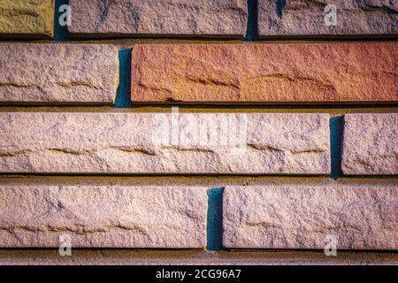 Coloured brick wall texture close up. Brick wall wallpaper design for web or graphic art projects.  Stock Photo