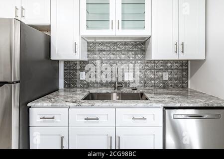 New modern kitchen in an apartment with stainless steel appliances. Real photo Stock Photo