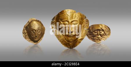 Mycenaean gold death masks from Grave Circle A, centre mask of Agamemnon, Mycenae, Greece. National Archaeological Museum of Athens.  Grey Background Stock Photo