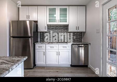 New modern kitchen in an apartment with stainless steel appliances. Real photo Stock Photo